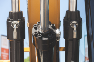 Hydraulic cylinders mounted on heavy equipment