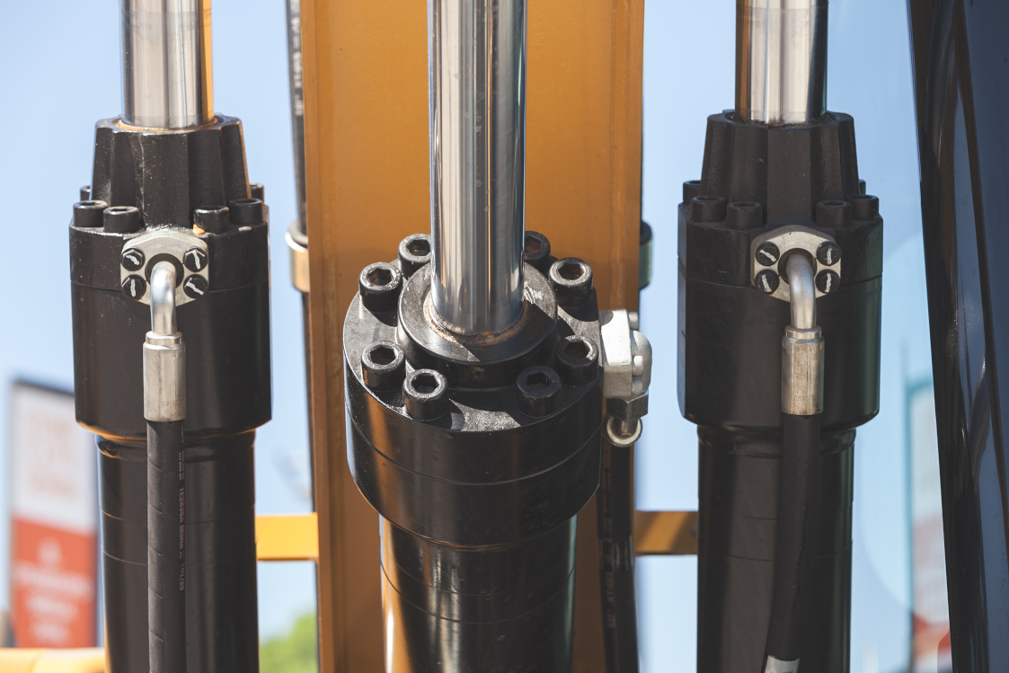 Hydraulic cylinders mounted on heavy equipment